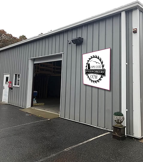 Veteran craftsmen working inside the North Falmouth woodworking shop